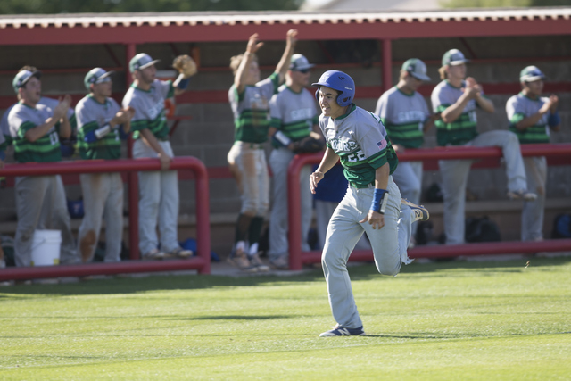 Green Valley’s Matt Uran (22) runs to home base for a run against Las Vegas in their b ...