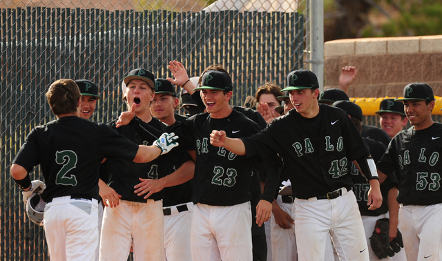 Palo Verde players greet Mitchell Rathbun (2) after he hit a two-run home run against Desert ...