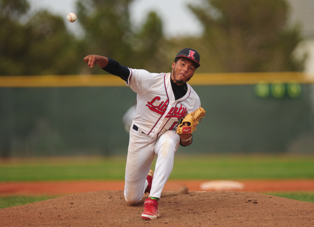 Liberty starting pitcher Ed O’Bannon delivers to Silverado in the first inning of thei ...