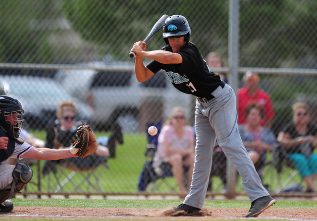 Silverado batter Dax Fellows is hit by a Liberty pitch in the third inning of their prep bas ...