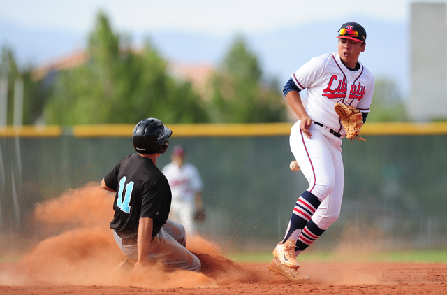 Silverado baserunner Dax Fellows steals second base while Liberty second baseman Omar Ortiz ...