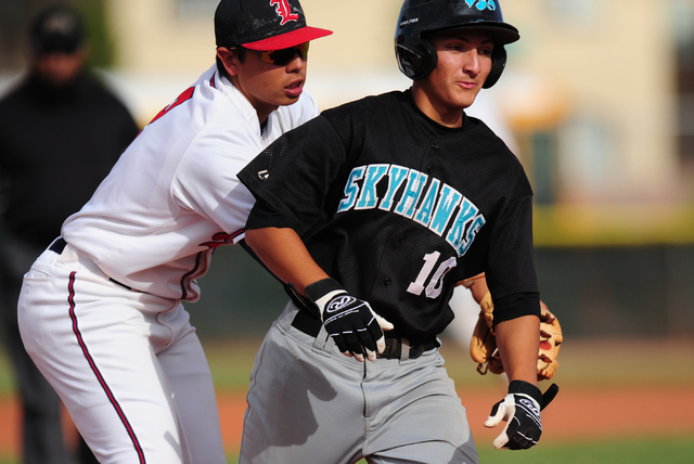 Liberty second baseman Omar Ortiz tags out Silverado baserunner Chase Cortez after Cortez wa ...