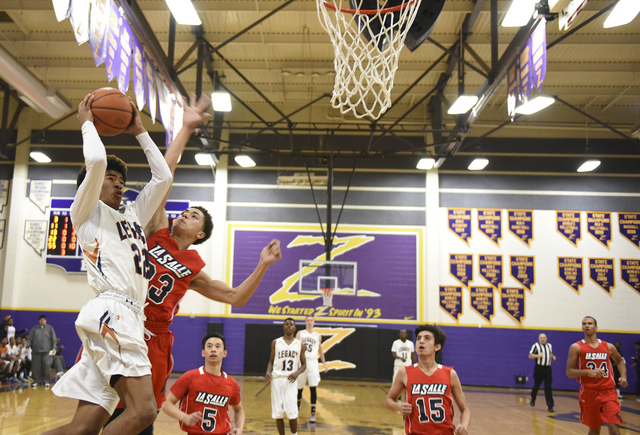 Legacy’s Shakir Arrey (22) goes up for a shot against LaSalle’s Johnny Knox (23) ...