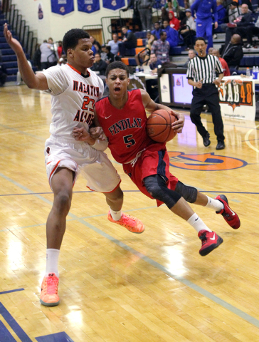 Findlay Prep point guard Derryck Thornton Jr. (5) drives past Wasatch Academy guard/forward ...