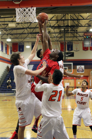 Findlay Prep forward Khalea Turner (24) goes up for a rebound over Wasatch Academy forward/c ...