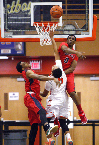 Findlay Prep forward Horace Spencer (0) denies Wasatch Academy guard Cody John (5) as Findla ...