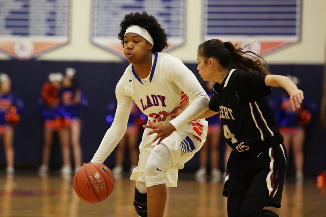 Bishop Gorman senior Skylar Jackson attempts to take the ball to the net on Monday, Feb. 6, ...