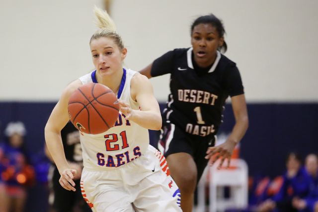 Bishop Gorman senior Samantha Coleman takes the ball to the basket as Desert Oasis junior Ta ...