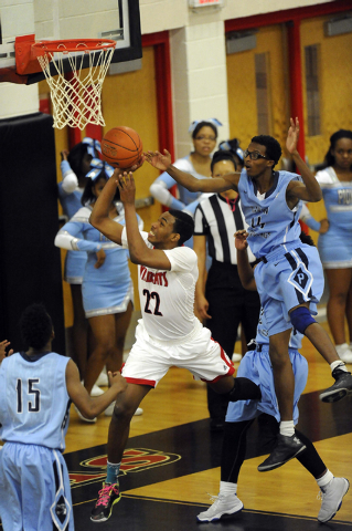 Las Vegas High guard Patrick Savoy (22) makes a layup against Canyon Springs forward Darion ...