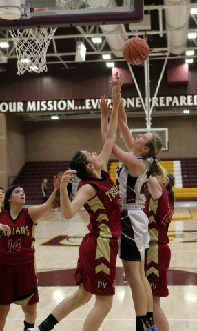 Faith Lutheran’s Morgan Hill (24) shoots over Pahrump’s Helen Vann (24) on Tuesd ...