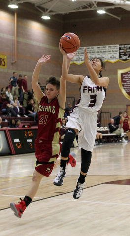 Faith Lutheran’s Maddie Bocobo (3) shoots past Pahrump’s Amber Skilling (21) on ...