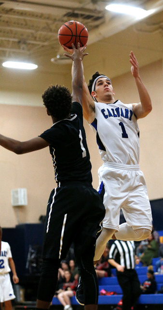 Calvary Chapel’s Elijah Martinez (1) shoots over Mountain View’s Tyrell Brooks, ...