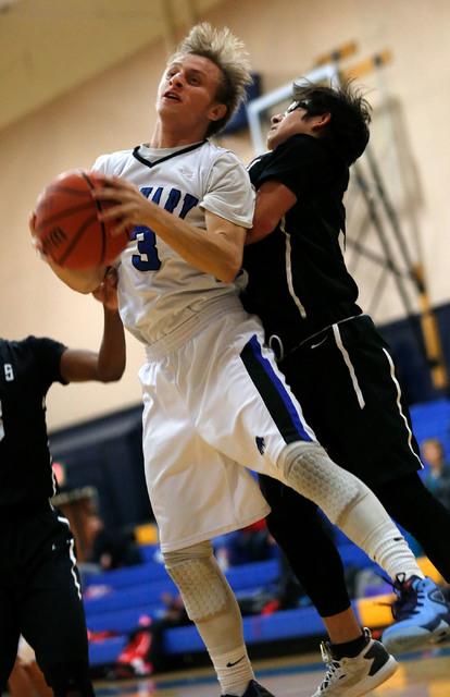 Calvary Chapel’s Christian O’ Kelley (3) tries to shoot as Mountain View’s ...