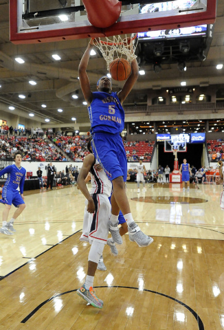 Bishop Gorman guard Charles O’Bannon Jr. (5) dunks against Findlay Prep during Saturda ...