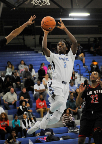 Canyon Springs’ Kajuan Casey shoots against Las Vegas High on Monday. Las Vegas won, 8 ...