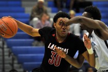 Las Vegas’ Tyler Bey (30) is defended by Canyon Springs’ D’Quan Crockett o ...