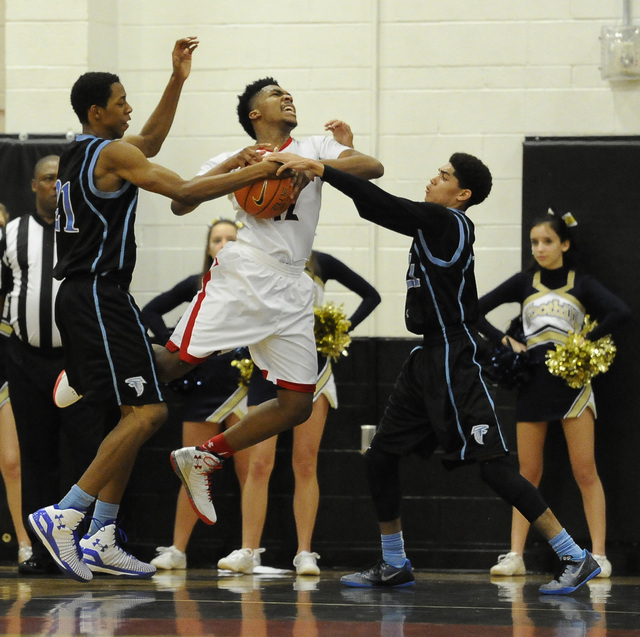 Foothill guard Kevin Woodland, right, and forward Torrance Littles,defend Las Vegas guard De ...