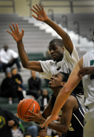 Agassi Prep’s Jordan Smith shoots against Rancho’s Kenneth Smith on Monday. Agas ...