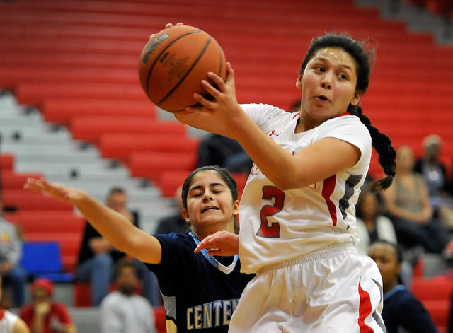 Arbor View’s Caroline Rivera (2) grabs a rebound against Centennial’s Sarah Krut ...