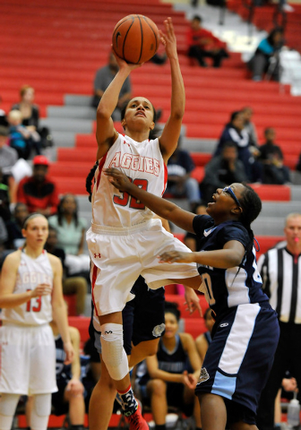 Arbor View’s janae Strode shoots against Centennial’s Tanjanae Wells on Monday. ...