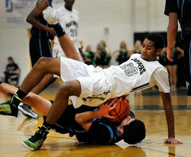 Palo Verde’s Dimitri Joyner (20) rolls over Foothill’s Colin Curi on Monday. Foo ...