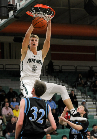 Palo Verde’s Grant Dressler (5) dunks the ball as Foothill’s Jonny Rolle looks o ...