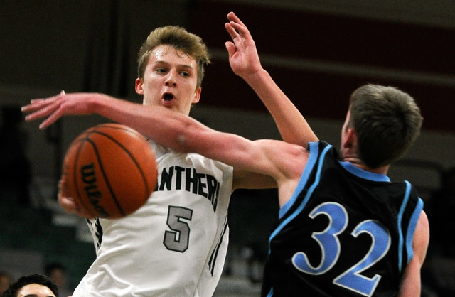 Palo Verde’s Grant Dressler (5) passes the ball around Foothill’s Jonny Rolle on ...