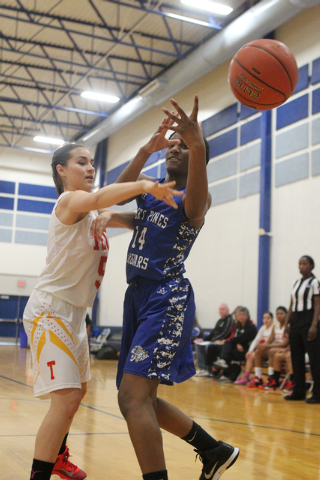 Tech’s Jasmine Ramos (5) knocks the ball loose from Desert Pines Tanauya Hinton (14) d ...