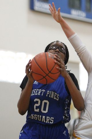 Desert Pines’ Adrianne Jackson (20) looks for an open shot against Tech in the Lady Wo ...