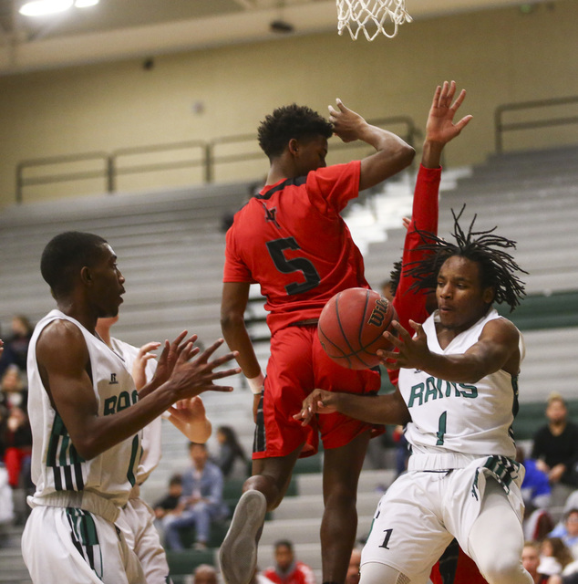 Rancho guard Jahleel Stevens (1) passes the ball as Las Vegas guard Deondre Northey (5) atte ...