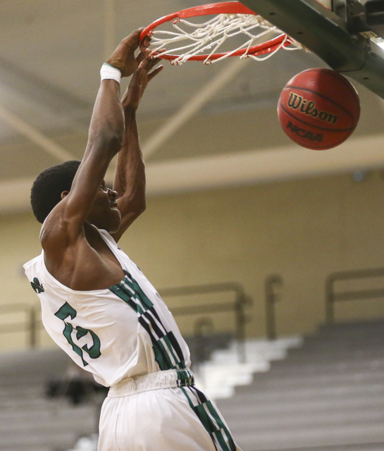 Rancho’s Justin Holiday (15) dunks against Las Vegas during a basketball game at Ranch ...