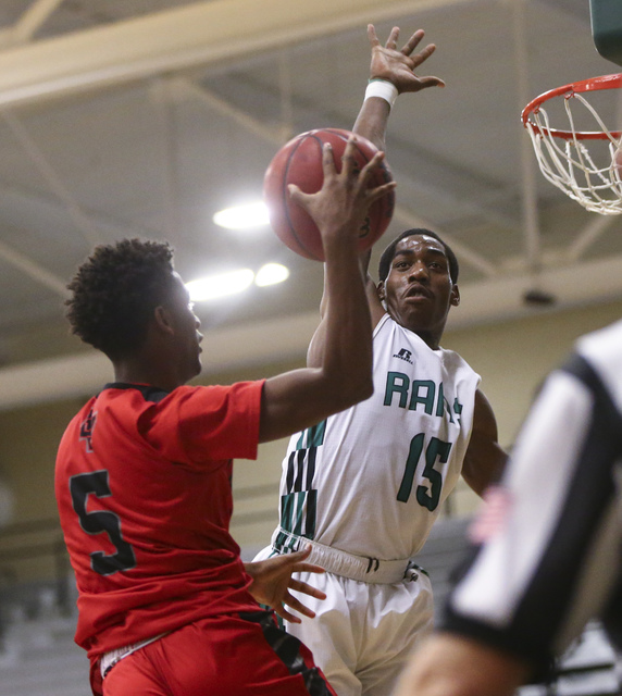 Rancho’s Justin Holiday (15) looks to block a shot from Las Vegas guard Deondre Northe ...