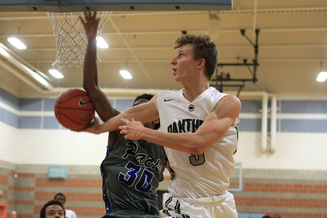 Palo Verde’s Grant Dressler puts up a reverse layup while being defended by Basic forw ...