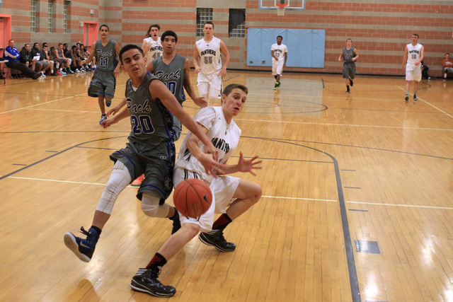 Basic guard Chaz Lucero knocks the ball out of the hands of Palo Verde’s Thomas Reymon ...