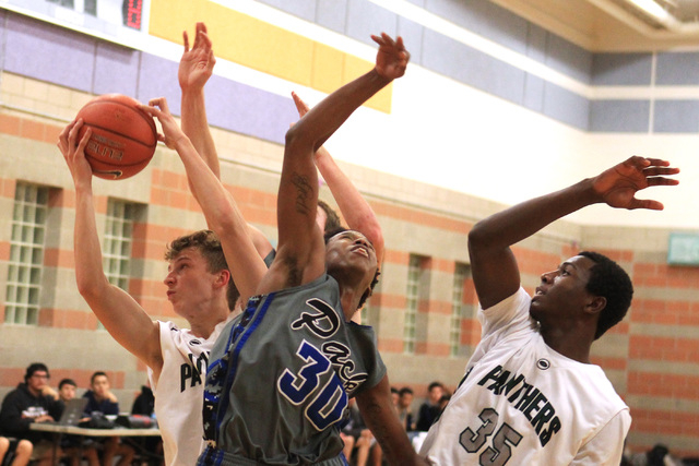 Palo Verde’s Grant Dressier grabs a rebound from Basic forward Rob Sutton on Friday. D ...