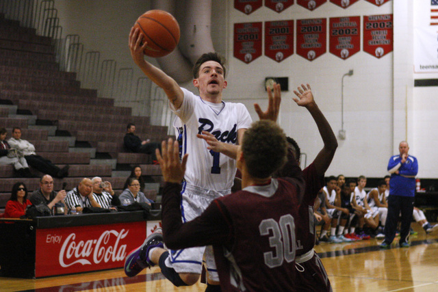 Basic guard Jared Meacham shoots over Cimarron-Memorial center Joe Tito during their Las Veg ...