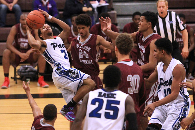 Basic guard Jaimen Williams puts up an off balance shot against Cimarron-Memorial during the ...