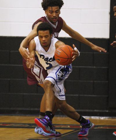 Basic guard Jaimen Williams steals the ball from Cimarron-Memorial’s Jaron Ponder duri ...