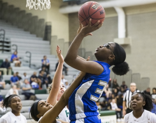 Sierra Vista’s Shania Harper (34) drives past Rancho’s Courtney Plumer (34) duri ...