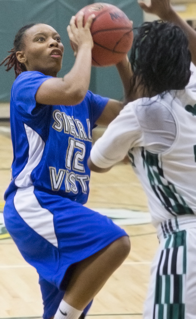 Sierra Vista’s Emonnie Jackson (12) shoots over Rancho’s Alesse Hall (21) durin ...