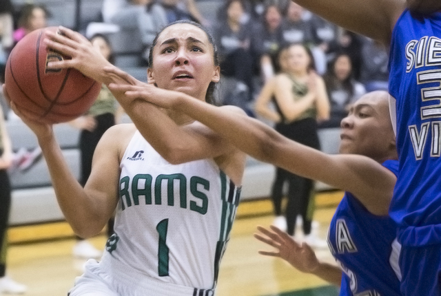 Rancho’s Lea Williams (1) drives past Sierra Vista’s Shania Harper (34) during t ...