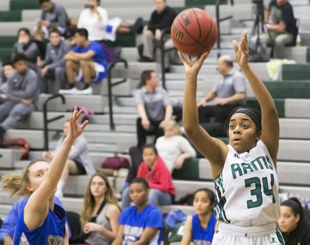 Rancho’s Courtney Plumer (34) shoots a three point shot during the Rams home matchup w ...