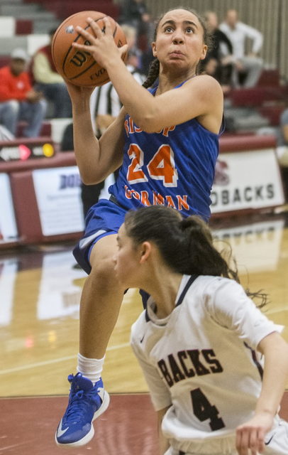 Bishop Gorman’s Bentleigh Hoskins (24) drives past Desert Oasis’ Brianna Clark ( ...