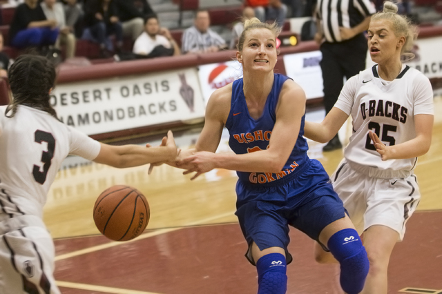 Bishop Gorman’s Samantha Coleman (21) is stripped on the way to the basket by Desert O ...