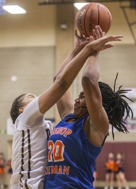 Bishop Gorman’s Skylar Jackson (20) gets fouled while shooting a jump shot by Desert O ...