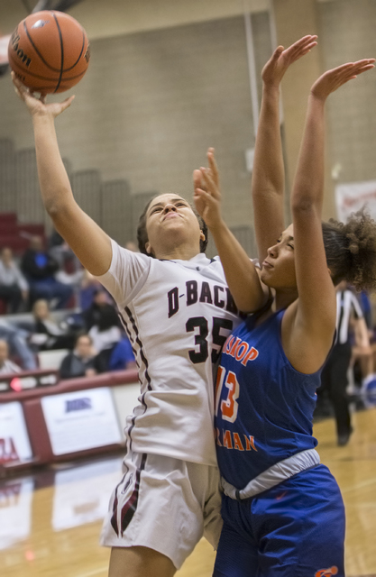 Desert Oasis’ Dajaah Lightfoot (35) shoots over Bishop Gorman’s Georgia Ohiaeri ...