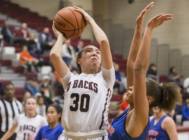 Desert Oasis’ Sierra Mich’l (30) shoots a jump shot over Bishop Gorman’s G ...