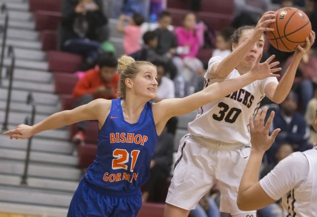 Bishop Gorman’s Samantha Coleman (21) reaches for a loose ball with Desert Oasis&#8217 ...