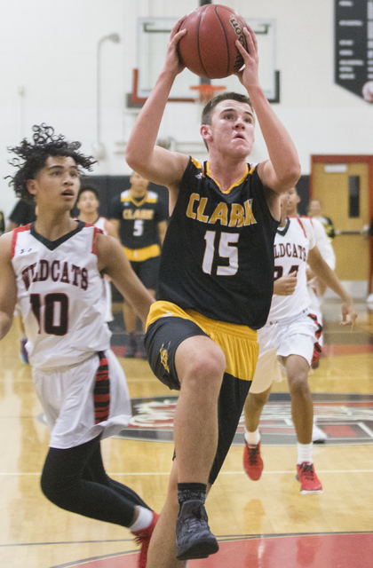 Clark’s James Bridges (15) drives past Las Vegas’ Josh Valencia(10) during the C ...