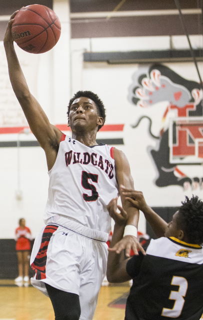 Las Vegas’ Deondre Northey (5) drives past Clark’s Joel Burney (3) during the Wi ...